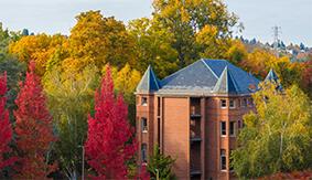 Alexander Hall in the fall with red and yellow leaves on the trees